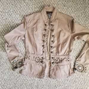 Tan jacket with various sized antique gold studs